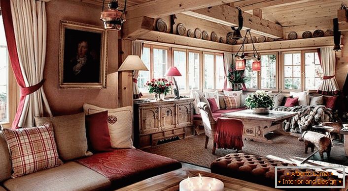 Akcenti crvene boje u sobu u planinskom stilu čine boravak romantičnom i estetski atraktivnom. 