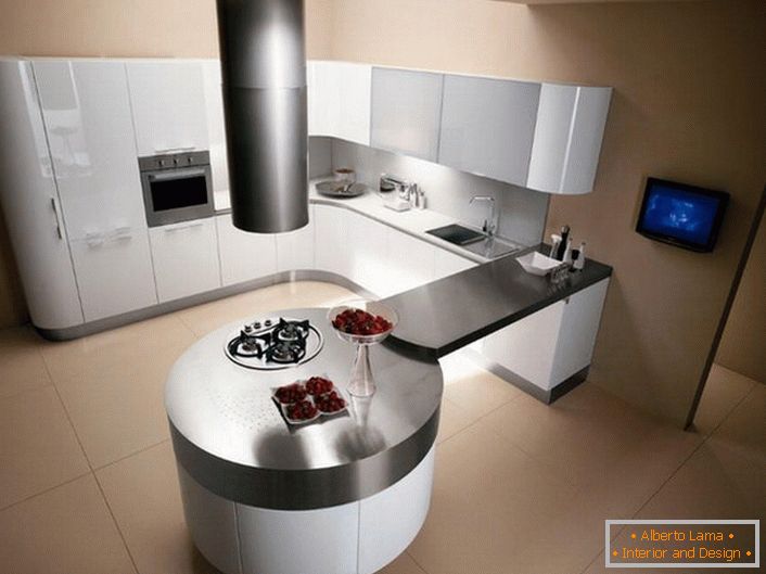 Kuhinja u stilu minimalizma se razlikuje pomoću jasno obrisanih geometrijskih oblika. Ovaj projekt je značajan za okrugli stol za blagovanje, u kombinaciji s countertop s kuhinjskim setom.