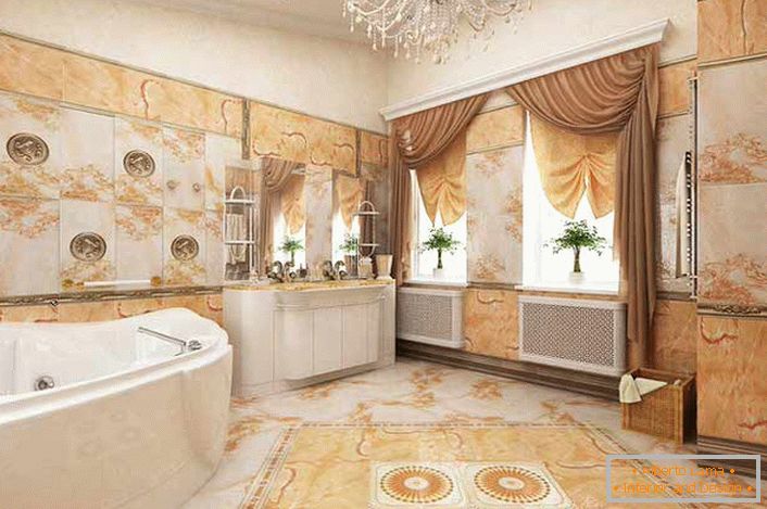 Boja bjelokosti harmonično se kombinira s nijansi svijetlo narančaste u kupaonici, ukrašena u stilu Empire.